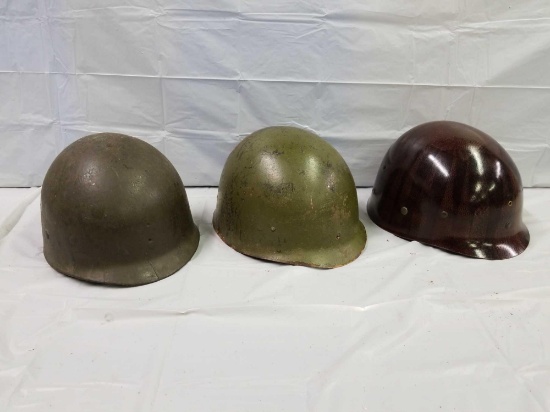 Group of three military helmet liners. All three appeared to be in good condition.