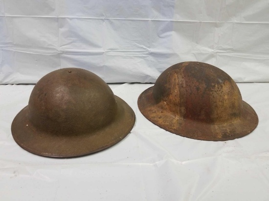 Pair of World War I military helmets. See photos for details.