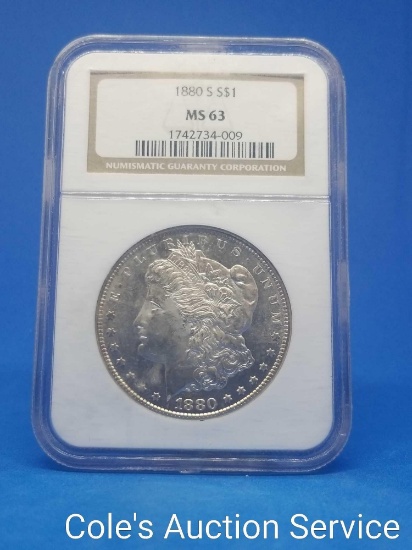 1880-s American US Mint Morgan silver dollar. Graded MS63 by NGC.