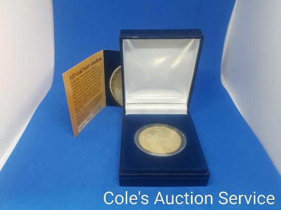 $20 gold tribute replica coin in display box. See photos for details.