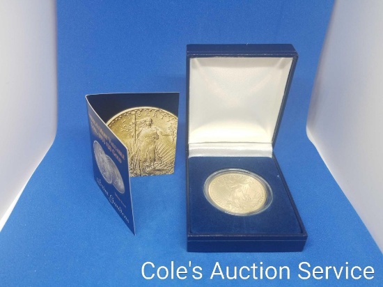 Replica $20 gold coin in display box. See photos for details.