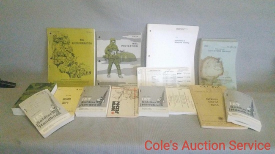 Large group of US military issue manuals and books. See photos for details.