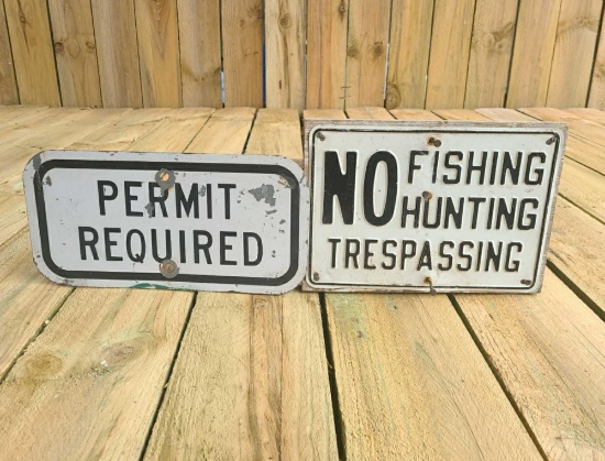 Pair of older metal signs.