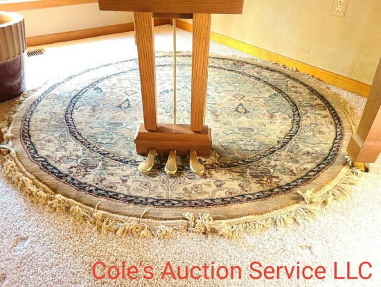 Nice looking round rug that is approximately 5 ft in diameter. Used under a piano so there was very