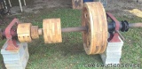Antique line shaft with wooden belt pulleys. Overall length is approximately 76