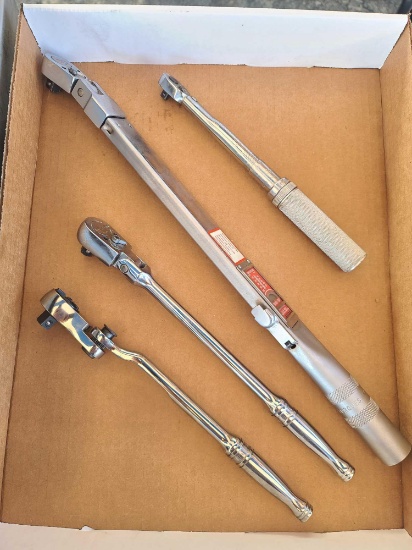 Snap-on torque wrenches and swivel ratchets.