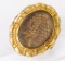 Gold color brooch with human hair
