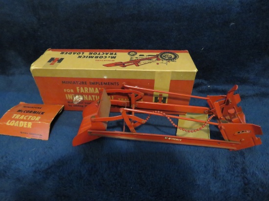 McCormick tractor loader in box (box is damaged)