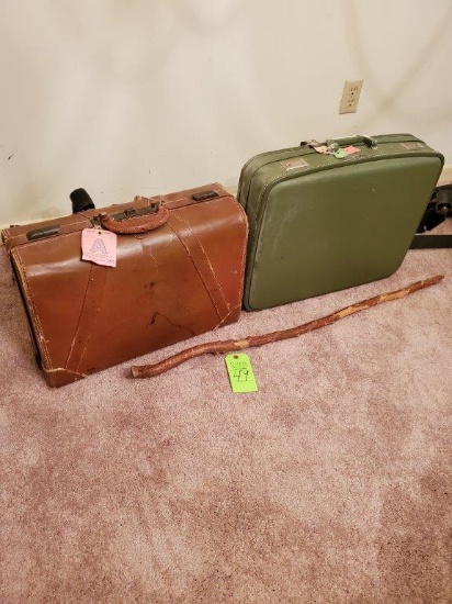 2 Suitcases & A Walking Stick