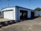 Metal Building with 5 Roll Up Doors & 1 Garage Door Approx. 20'X35'