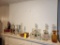 Contents on Fireplace Mantle- Decanters