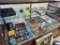 Contents of 4th Display Case - Belt Buckles, Charms, Antlers, Misc. Pictures, Toy Gun