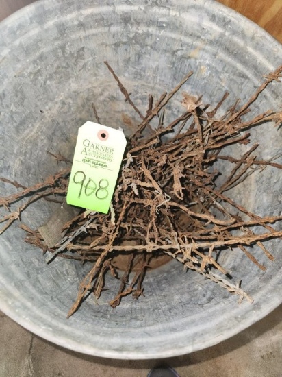 Metal Trash Can of Barbed Wire