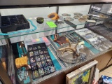 Contents of 4th Display Case - Belt Buckles, Charms, Antlers, Misc. Pictures, Toy Gun