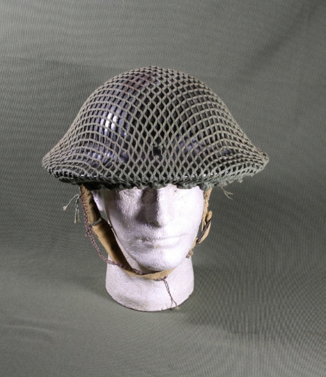 British WWII helmet w/camp net, liner and chin strap