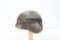 U.S. Army Kevlar helmet with camo cover.
