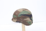 U.S. Army Kevlar helmet with camo cover.