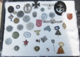 Small Glass case with 37 Nazi pins, and memoriabilia items, some officer pins