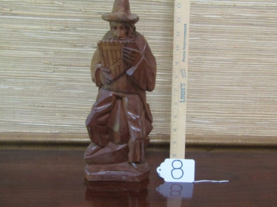 Hand Carved Wood Statue Of A Man Playing A Pan Flute