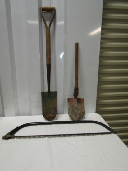 2 Wood Handled Shovels And A Bow Saw (NO SHIPPING))
