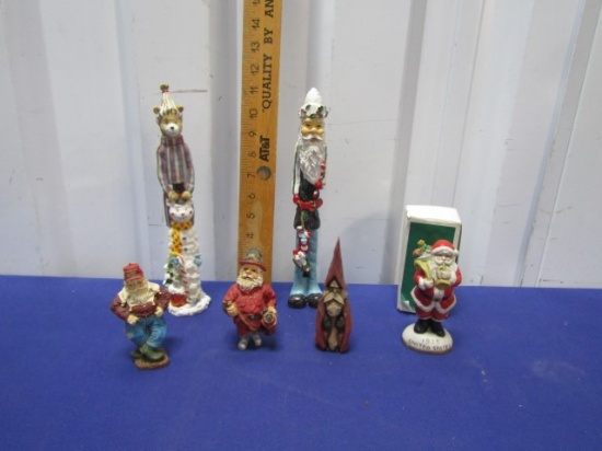4 Resin, 1 Porcelain And 1 Carved Wood Christmas Figurines