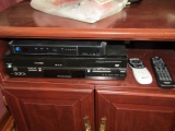 Toshiba V C R / D V D Player, The Direct T V Box On Top Of It And Remote Control For Both