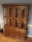 Henredon Furniture Artefacts Collection Lighted China Cabinet w/ Glass Shelves on 4 Panel Door Base