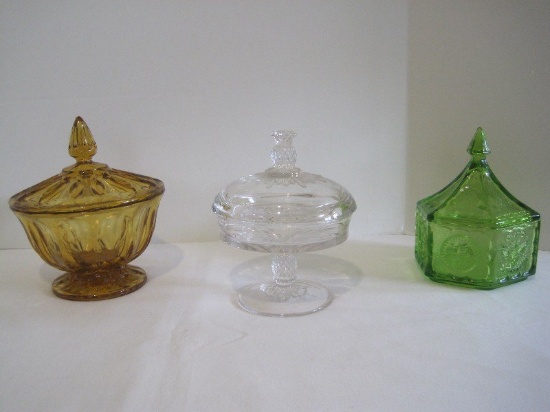 Lot - 3 Covered Candy Dishes, Clear Pedestal w/ Pineapple Finial 6 1/2", Amber Footed 7"