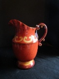 Glazed Ceramic Pitcher Red/Flared Rim Ornate Curled Handle Urn Design