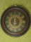 Antiqued Patina Disc Wall Clock w/ Foliate Gilt Band 7 Roman Numerals