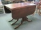 Mahogany Triple Pedestal Drop Leaf Table w/ Brass Finish Caps & Protective Cover