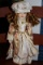 Unique 1-5000 Doll Porcelain Face/Hands/Feet in Colorful Ornate Dress/Hat w/ Stand