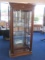 Exquisite Lighted Curio w/ Glass Shelves, Mirrored Back, Grooved Glass Front Panel Flanked by
