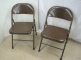 2 Brown Metal Folding Chairs