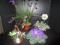 Lot - Faux Flowers in Misc. Plates, Wicker Basket, Pot, Leaf Motif Planter, Etc.