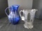 Lot - Ornate Oval/Scallop Patterns Glass Jug, Blue Glass Jug, Various Heights