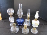 Lot - 7 Miniature Oil Lamps, 1 Milk Glass Floral Pattern, 1 Blue, Etc.