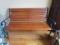 Wooden Bench Slat Design w/ Curled Black Arms