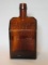 E.G. Booz Amber Pressed Glass Old Cabin Design Bottle