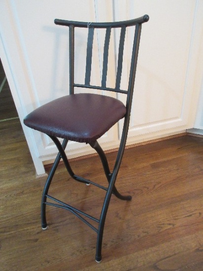 Black Metal Folding Stool w/ Curved Back Rest & Vinyl Upholstered Seat