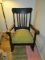 Vintage Wooden Rocker, Curled Arms, Slat Back, Spindle Sides, Green Upholstered Seat