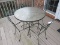 Black Metal Patio Table w/ Glass Top Curled/Scroll Design, Leaf Pattern Trim w/ 4 Chairs