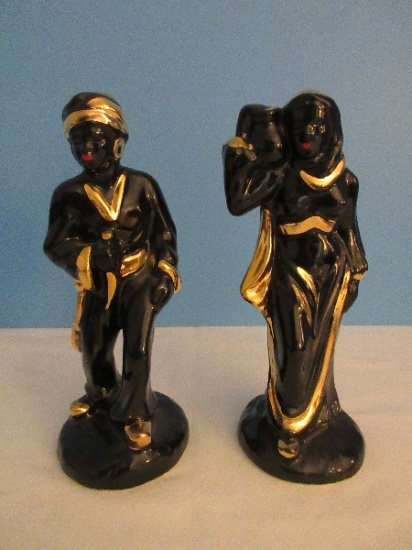 Pair - Ceramic Black Moor Style 9 1/2" Woman Carrying Vessel Gilt Trim & Man w/ Dagger