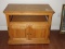 Oak T.V. Stand Cabinet on Casters Middle Slide Out Shelf & Double Panel Base Doors