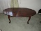 Queen Anne Style Simulated Mahogany Wood Grain Oval Cocktail Table