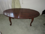 Queen Anne Style Simulated Mahogany Wood Grain Oval Cocktail Table