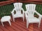 Pair - Stackable Plastic Frame Stationary Adirondack Chairs w/ Side Table