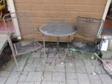 2 Metal Patio Chairs Scroll/Lattice Motif w/ Grey Stone Round Top Table Block Metal Scroll Legs