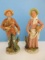 Pair - Homeco Bisque Porcelain Elderly Man Gathering Wood & Woman Figurines