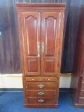 Traditional Cherry Finish Pier Cabinet Features Hinged Trim Molding Hidden Compartment